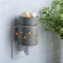 Jasmine Pluggable Fragrance Warmer plugged into powerpoint