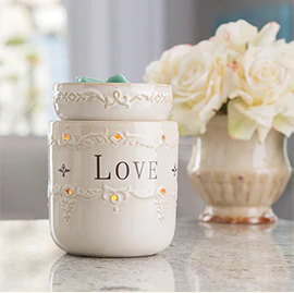 The Live Love Laugh Illumination Fragrance Warmer features an ivory reactive glazed warmer which keeps the important things in life in mind. 